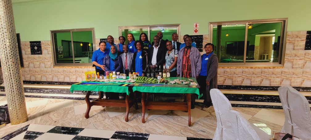 Delegates behind a table of ZOFAZ member products.